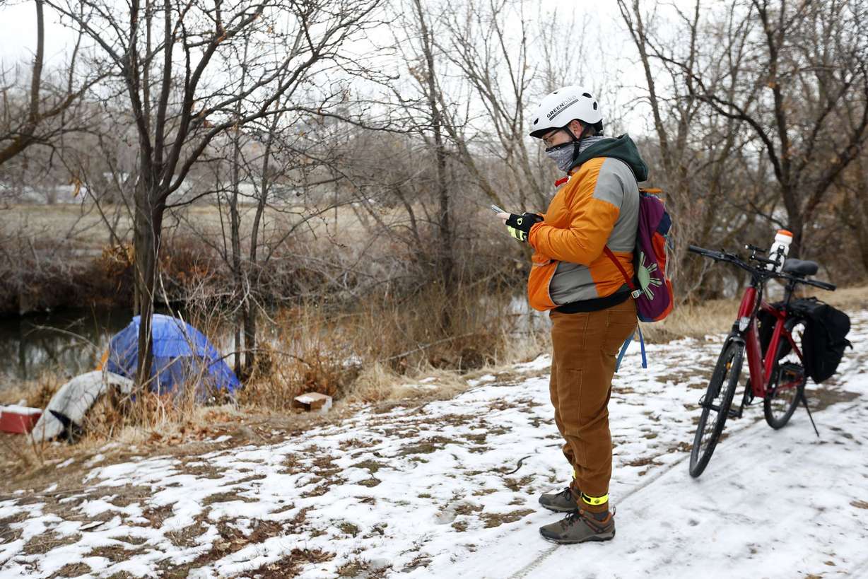 Soren Simonsen, executive director of the Jordan River Commission, takes down information as to where he is seeing homeless camps during the 2021 Point-in-Time count, a nationwide annual event to survey people experiencing unsheltered homelessness, in Salt Lake City on Thursday, Jan. 28, 2021.