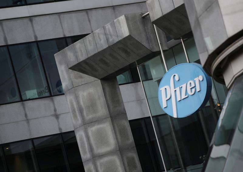 FILE PHOTO: The Pfizer logo is pictured outside a Pfizer office amid the coronavirus disease (COVID-19) outbreak in Brussels, Belgium January 21, 2021. REUTERS/Yves Herman/File Photo  GLOBAL BUSINESS WEEK AHEAD