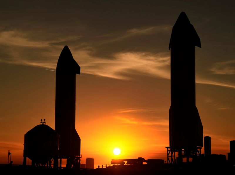 FILE PHOTO: SpaceX starships SN9(L) and SN10 continue to wait for test flights as the sun sets at the launch facilities in Boca Chica, Texas, February 1, 2021.  REUTERS/Gene Blevins/FIle Photo