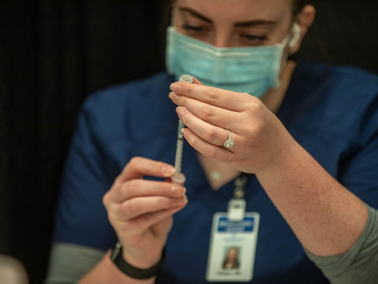 Kaitlyn Ulibarri prepares a COVID-19 vaccine at a
vaccination clinic in Spanish Fork on Monday, Feb. 1, 2021.