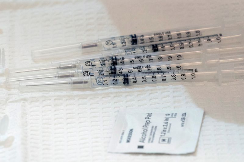 FILE PHOTO: Dead volume syringes filled with the COVID-19 vaccine are seen at a pop-up vaccination site in William Reid Apartments in Brooklyn, New York City, U.S., January 23, 2021. Mary Altaffer/Pool via REUTERS