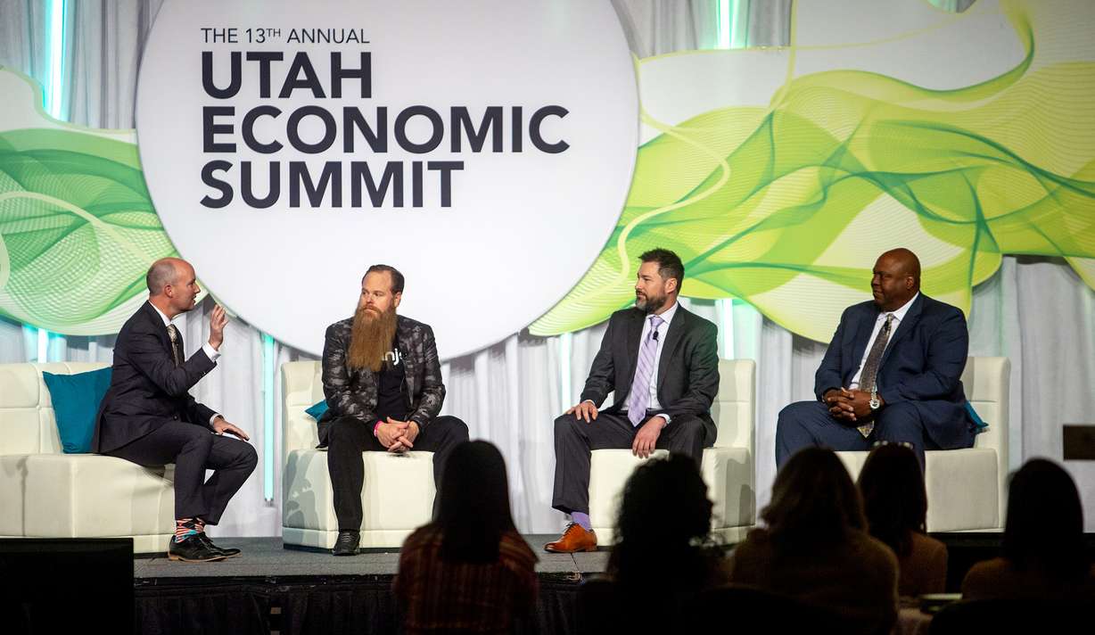 FILE - Utah Lt. Gov. Spencer Cox sits down with Damien Patton, founder and CEO of Banjo, Daniel Gelston, president of the broadband communications sector at L3 Technologies, and Shawn Newell, former University of Utah and Chicago Bears football player and vice president for Industrial Supply Company, at the 13th annual Utah Economic Summit at the Grand America Hotel in Salt Lake City on Friday, May 17, 2019.