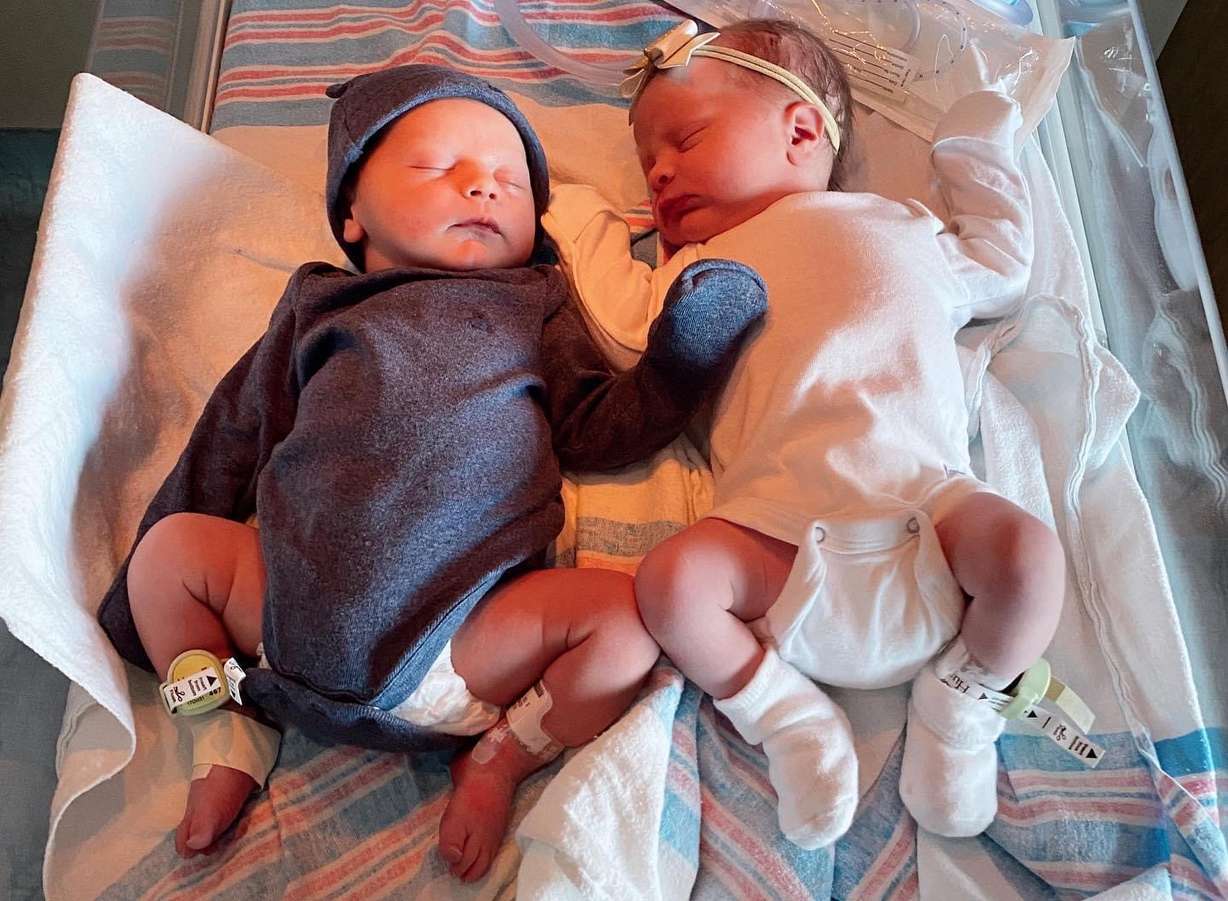 Cousins Grey Smith and Remi Trowbridge share a hospital warming bed.