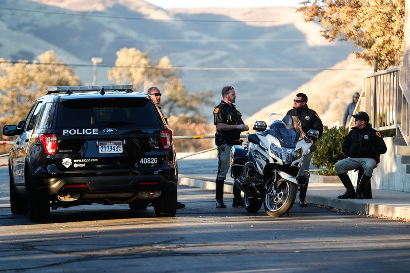 Police officers deployed around state epidemiologist Dr. Angela Dunn’s house in Salt Lake City are pictured on Thursday, Oct. 29, 2020.