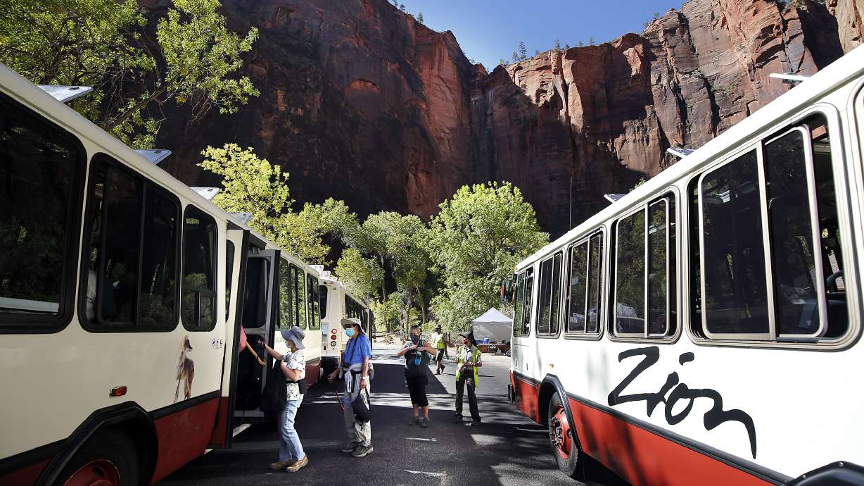 Visitors board a shuttle at Zion National Park on Wednesday, Oct. 14, 2020.