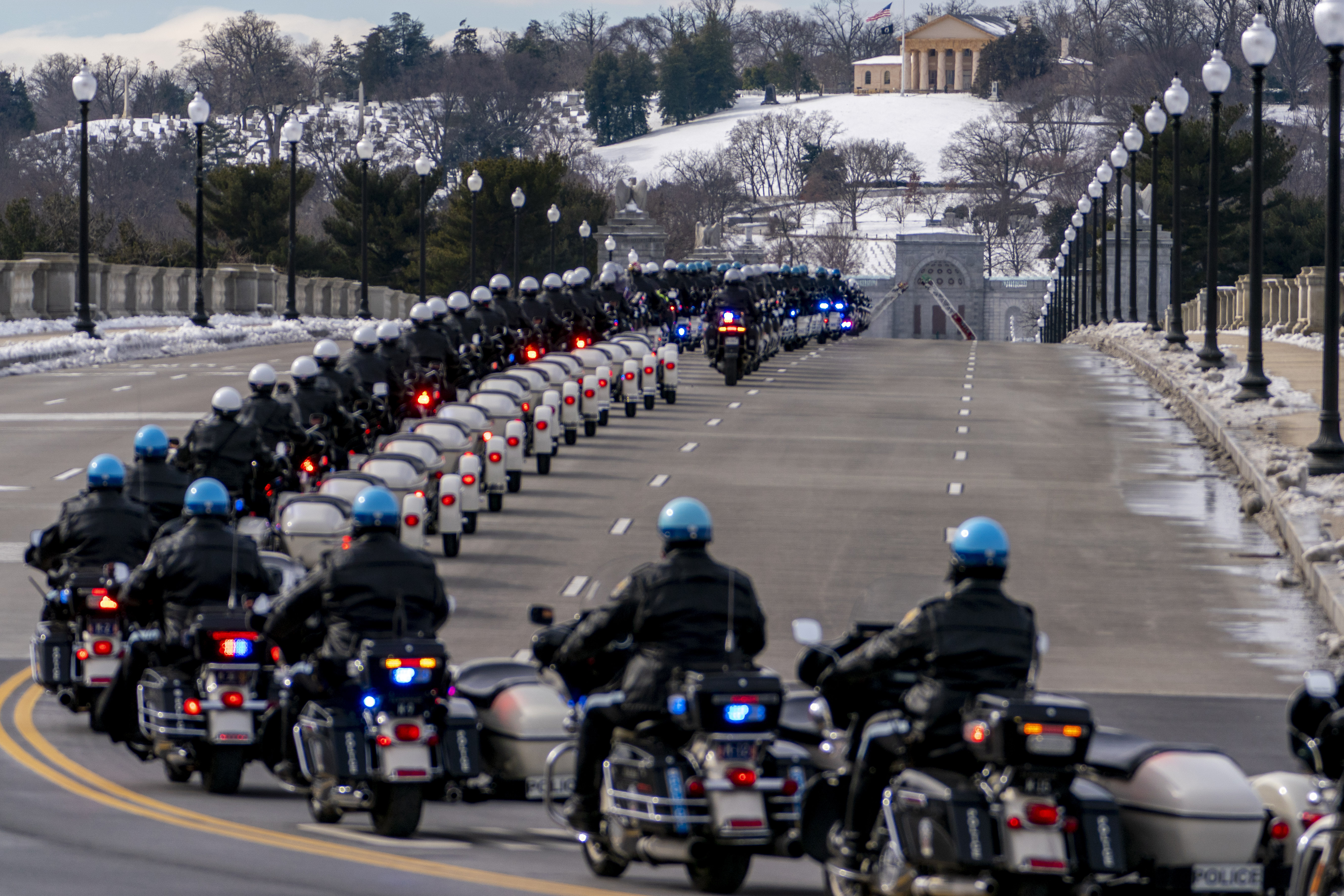 U.S. Capitol Police officers on motorcycles ride ahead of a hearse carrying the remains of U.S. Capitol Police officer Brian Sicknick as it makes its way to Arlington National Cemetery after Sicknick was lying in honor at the U.S Capitol, Wednesday, Feb. 3, 2021, in Washington. (AP Photo/Andrew Harnik) [Feb-03-2021]