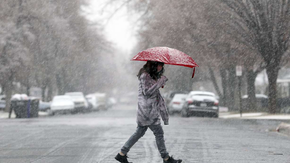 Reality Chavez walks through the snow in the Liberty Wells neighborhood of Salt Lake City on Feb. 3. Salt Lake City hasn't received measurable snow since March 25 but that's forecast to change by the end of the week. However, Utah's mountains are forecast to receive most of the snow this week, beginning with a storm arriving Monday evening.