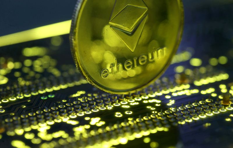 FILE PHOTO: Representation of the Ethereum virtual currency standing on the PC motherboard is seen in this illustration picture, February 3, 2018. REUTERS/Dado Ruvic/Illustration