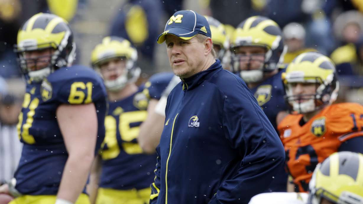 Michigan offensive line coach Darrell Funk is seen during an NCAA college football spring scrimmage in Ann Arbor, Mich., Saturday, April 13, 2013. (AP Photo/Carlos Osorio)