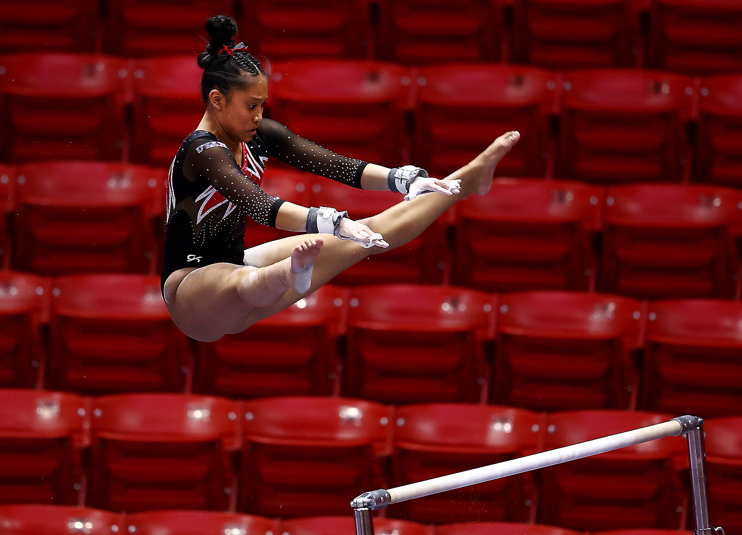 Utahâs Alani Sabado eyes the upper bar during her routine as Utah and Washington compete in an NCAA gymnastics meet at the Huntsman Center in Salt Lake City on Saturday, Jan. 30, 2021. No. 4 Utah won 197.475-193.300.