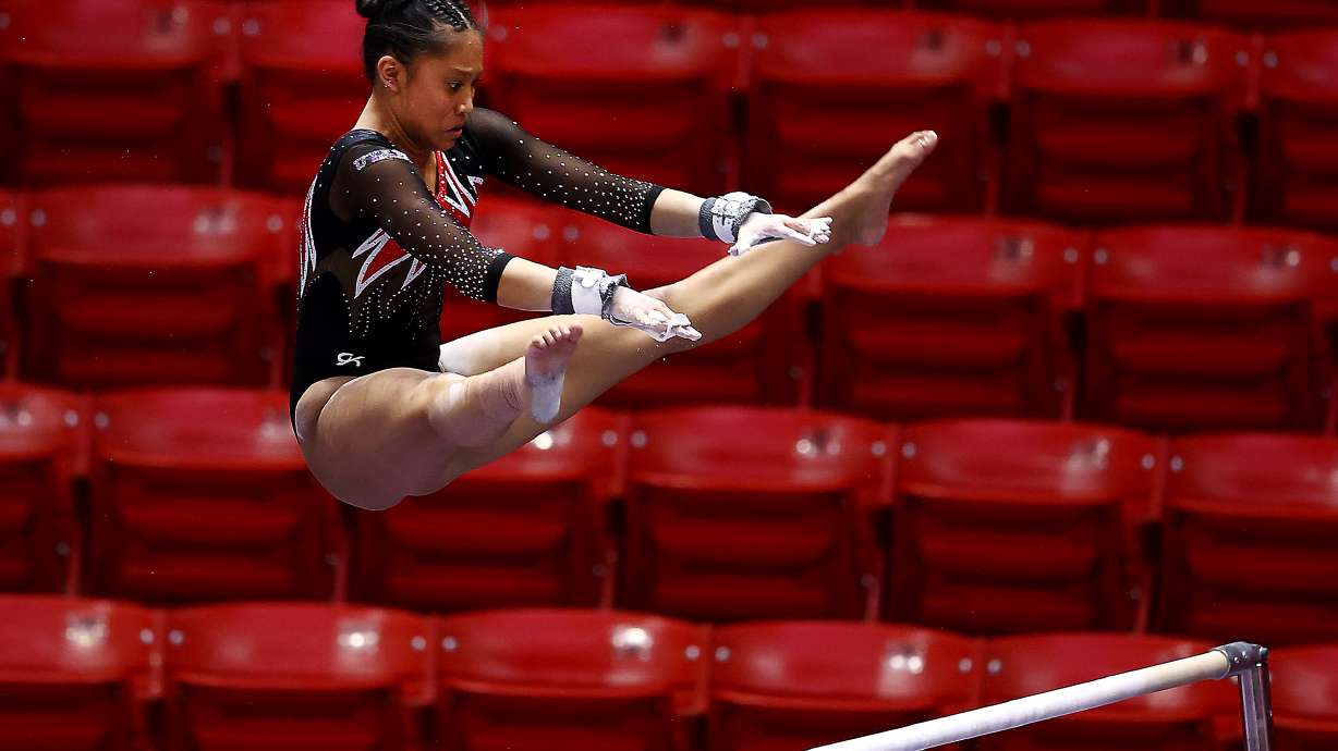 Utahâs Alani Sabado eyes the upper bar during her routine as Utah and Washington compete in an NCAA gymnastics meet at the Huntsman Center in Salt Lake City on Saturday, Jan. 30, 2021. No. 4 Utah won 197.475-193.300.