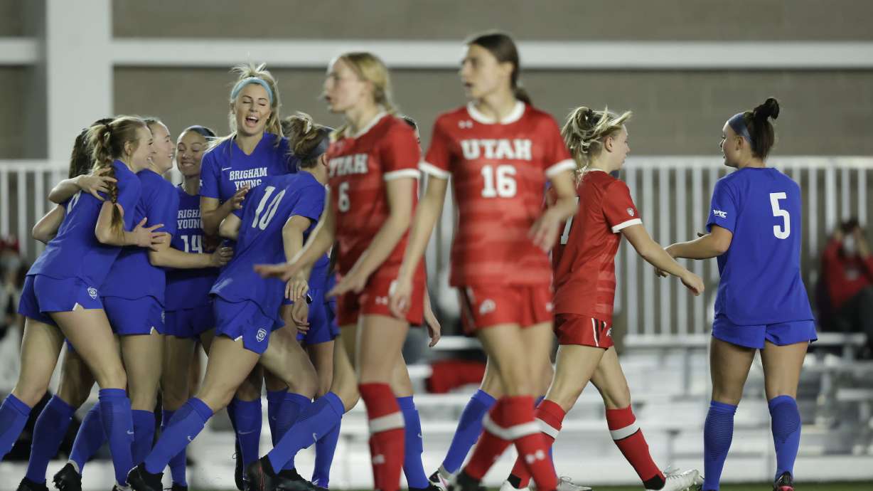 BYU's Cameron Tucker, center, celebrates her first goal with her teammates during the Cougars' season opener Saturday, Feb. 6, 2021 at the RSL indoor training facility in Herriman.