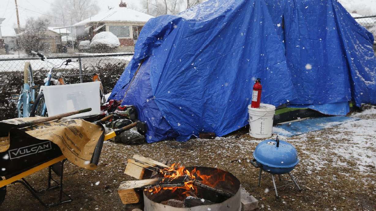 A tent belonging to a homeless couple is seen in Darin
Mann’s yard in Salt Lake City on Friday, Feb. 5, 2021. A woman, who
had been camping at Mann’s home, Saturday night. Mann said police
told him they suspected carbon monoxide poisoning, as the couple
had been burning coals or wood inside the tent in an effort to stay
warm.
