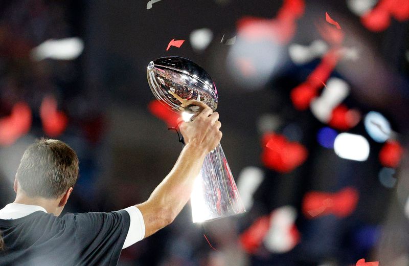Tampa Bay Buccaneers' Tom Brady celebrates with the Vince Lombardi trophy after winning the Super Bowl LV.