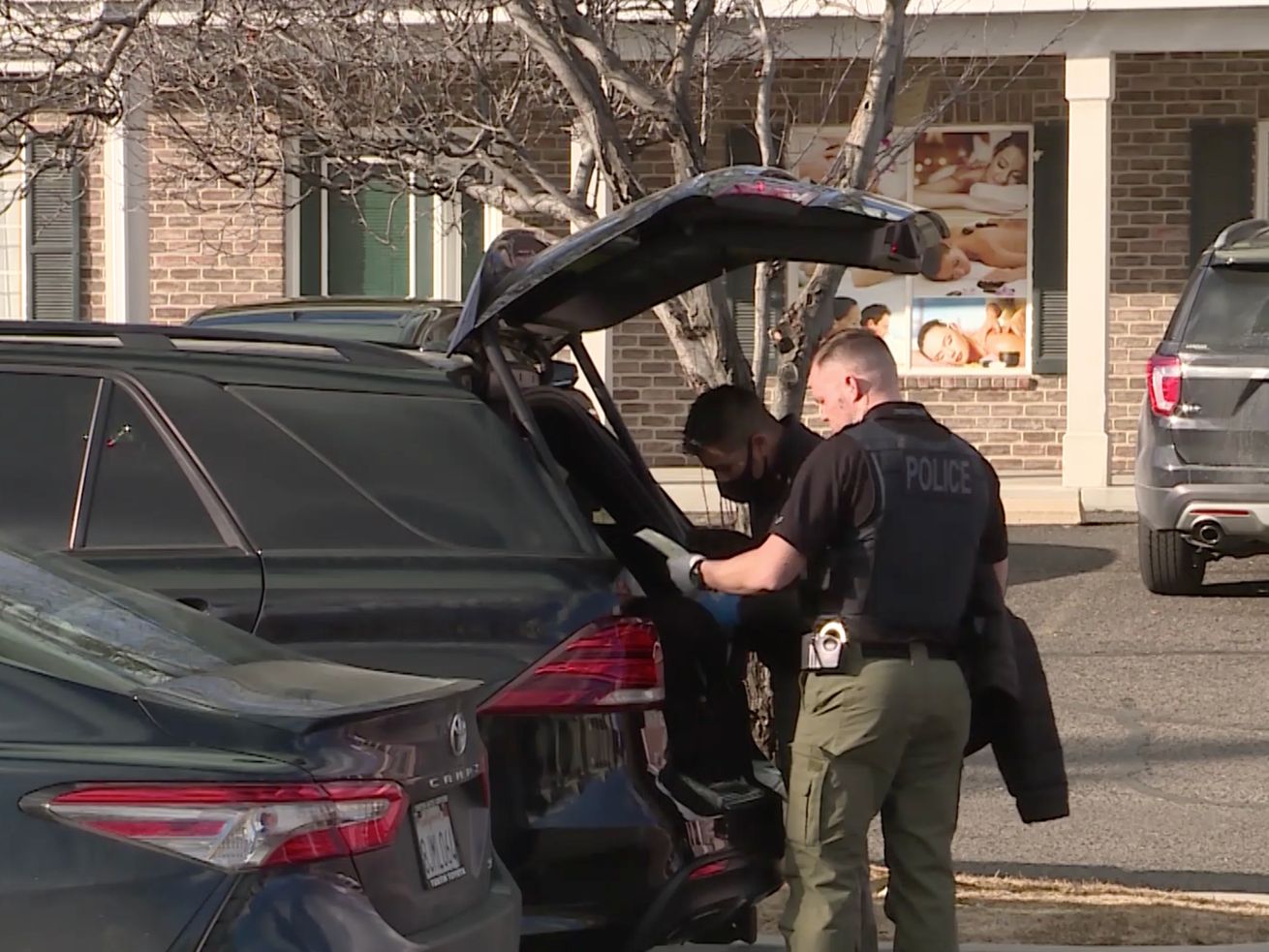 Police officers search a vehicle outside of Rainbow
Massage in Orem on Thursday, Feb. 4, 2021. At least six people
were arrested Thursday following an investigation into several
massage parlors in Utah County that police say were fronts for
human trafficking and prostitution. Three more were arrested over
the weekend at the Salt Lake City International Airport.