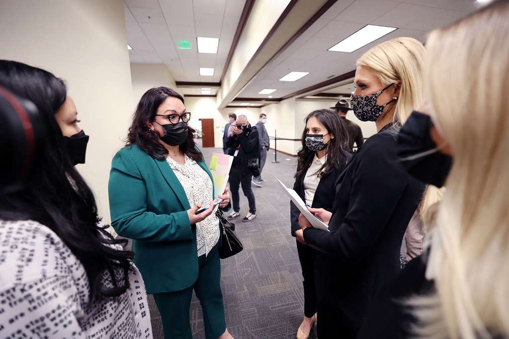 Sen. Luz Escamilla, D-Salt Lake City talks with Paris Hilton and Caroline Lordon after they testifed in the Senate Judiciary, Law Enforcement and Criminal Justice Committee at the Capitol in Salt Lake City on Monday, Feb. 8, 2021. Sen. Mike McKell, R-Spanish Fork is sponsoring S.B. 127 Human Services Program Amendments.