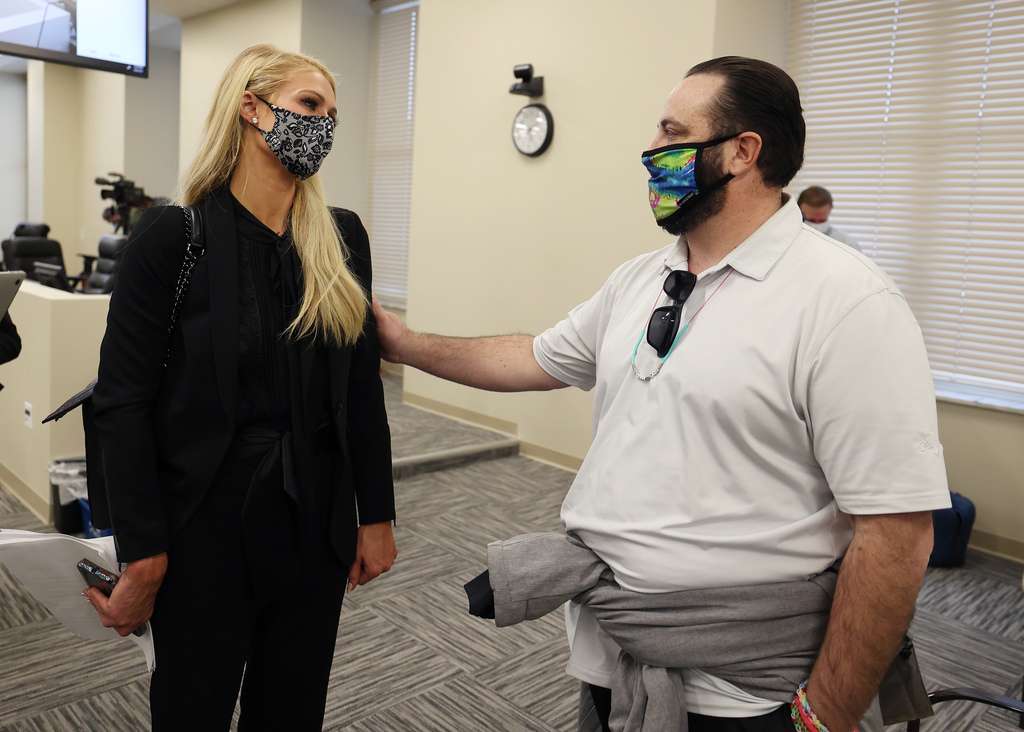 Paris Hilton, talks with Jeff Netto after they testified in the Senate Judiciary, Law Enforcement and Criminal Justice Committee at the Capitol in Salt Lake City on Monday, Feb. 8, 2021.