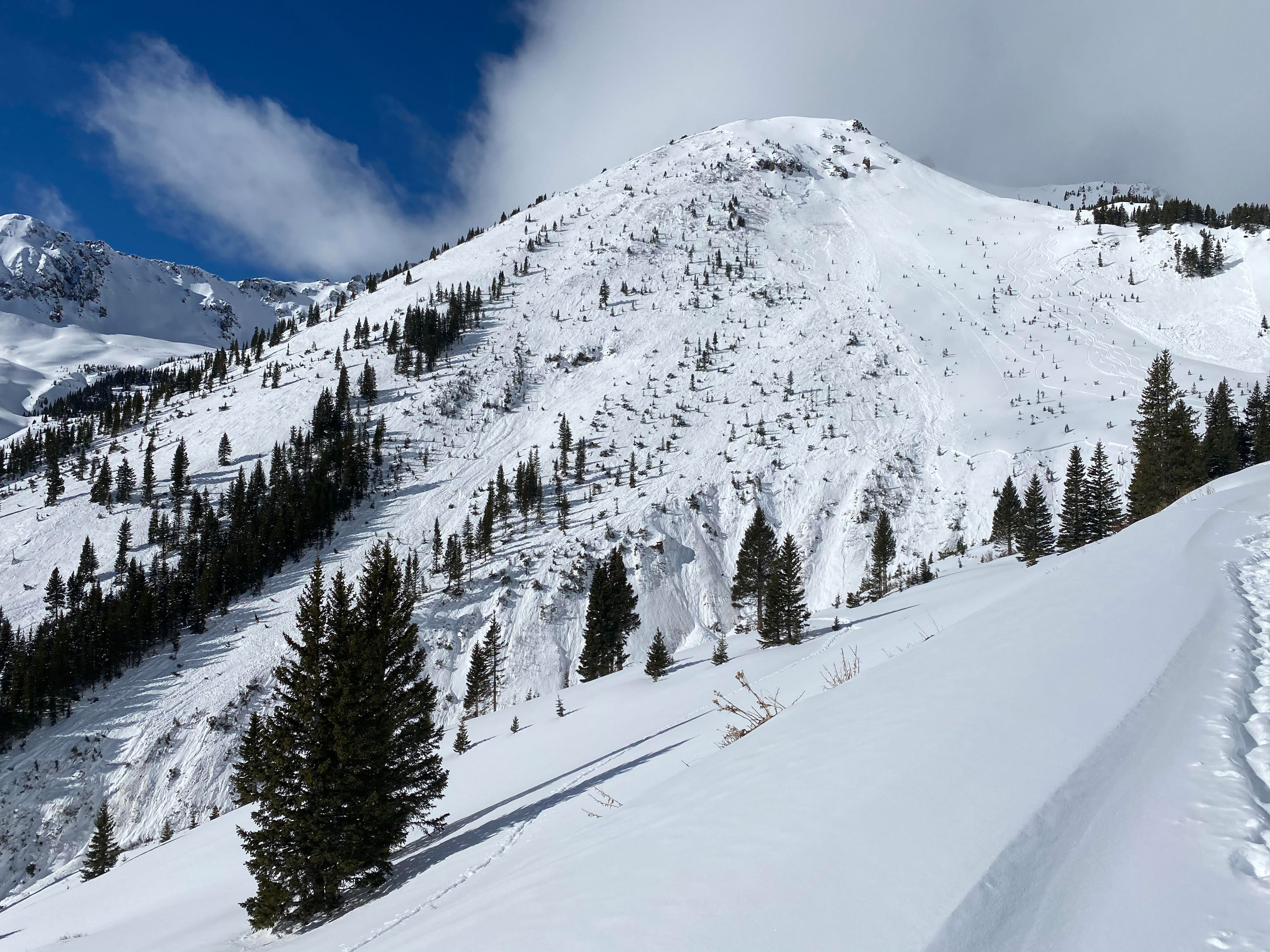 At least 14 people died in avalanches last week, the deadliest week of US avalanches on record. This image shows the avalanche that caught four skiers on February 1, 2021.