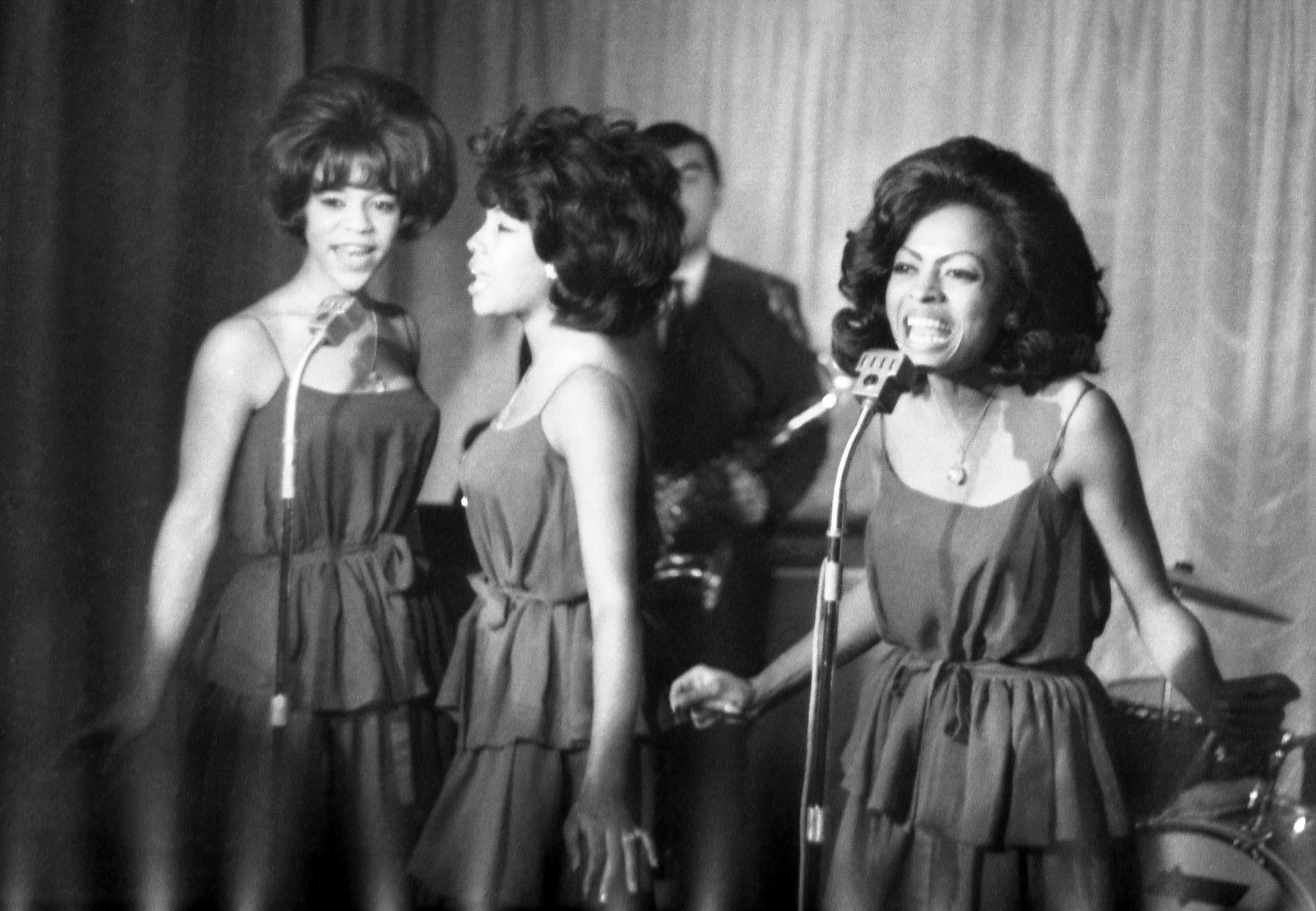 FILE - In this Oct. 8, 1964 file photo, The Supremes, from left, Florence Ballard, Mary Wilson and Diana Ross, perform during a reception for them in a hotel, in London. Wilson, the longest-reigning original Supreme, has died at 76 years old. Publicist Jay Schwartz says Wilson died Monday, Feb. 8, 2021, at her home in Las Vegas and that the cause was not immediately clear. (AP Photo/Bob Dear, File) [Feb-09-2021]