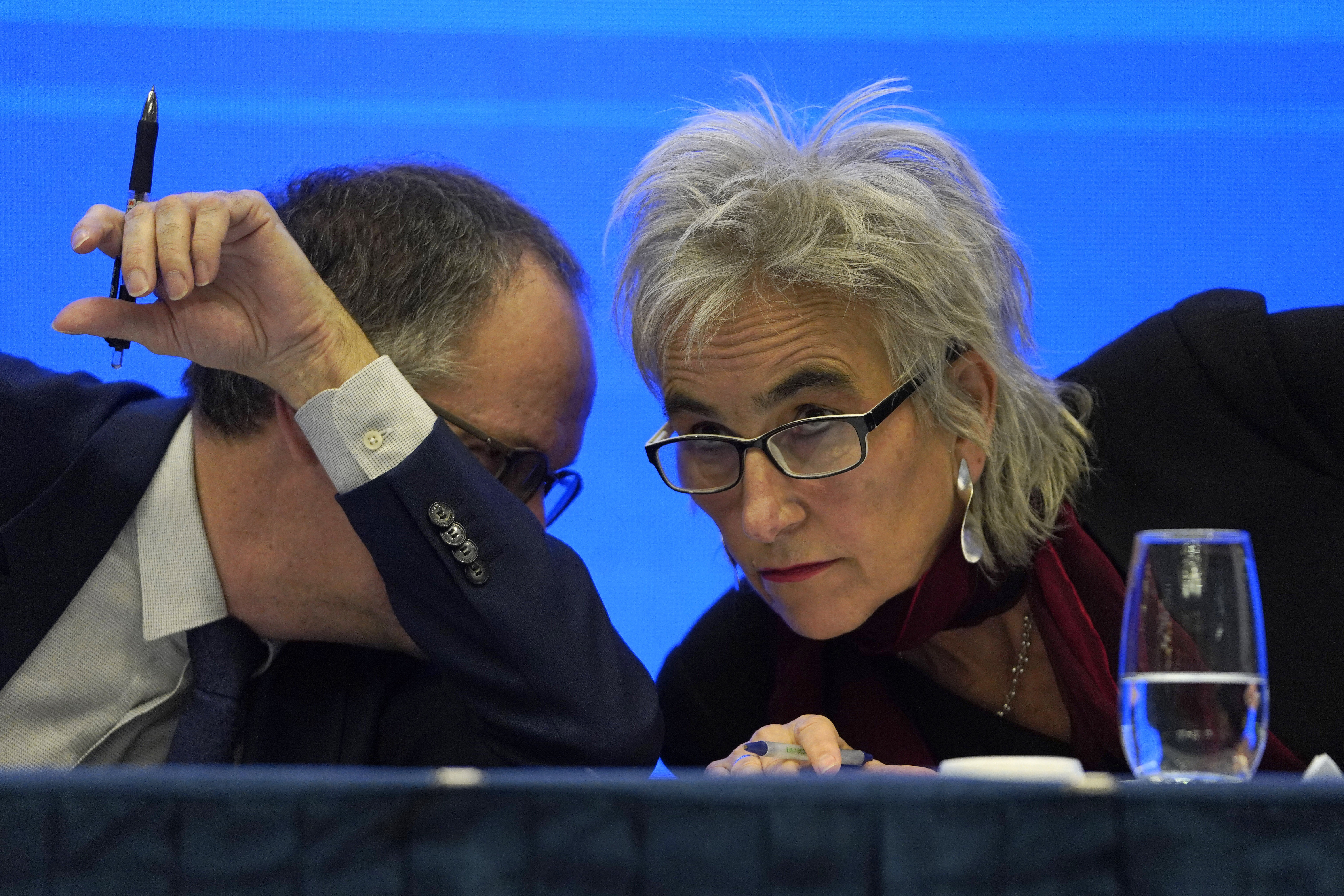 Marion Koopmans, right, and Peter Ben Embarek of a World Health Organization team chat each other during a joint press conference at the end of their mission to investigate the origins of the coronavirus pandemic in Wuhan in central China's Hubei province, Tuesday, Feb. 9, 2021. (AP Photo/Ng Han Guan) [Feb-09-2021]