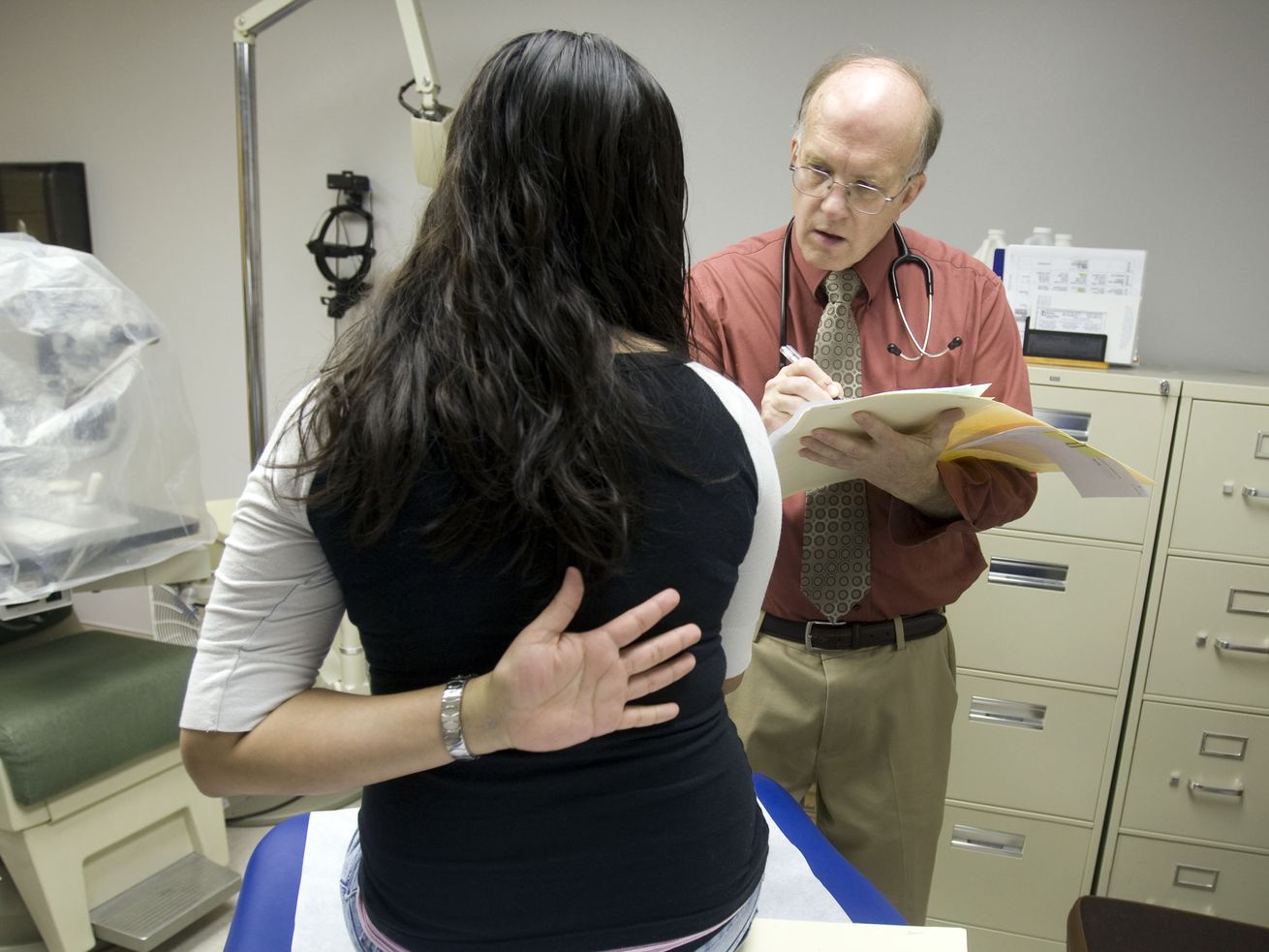 Pediatrician, Dr. Derrel Clarke talks with a teenager
during a check up visit at the Cache Valley Community Health Clinic
in this 2009 file photo.