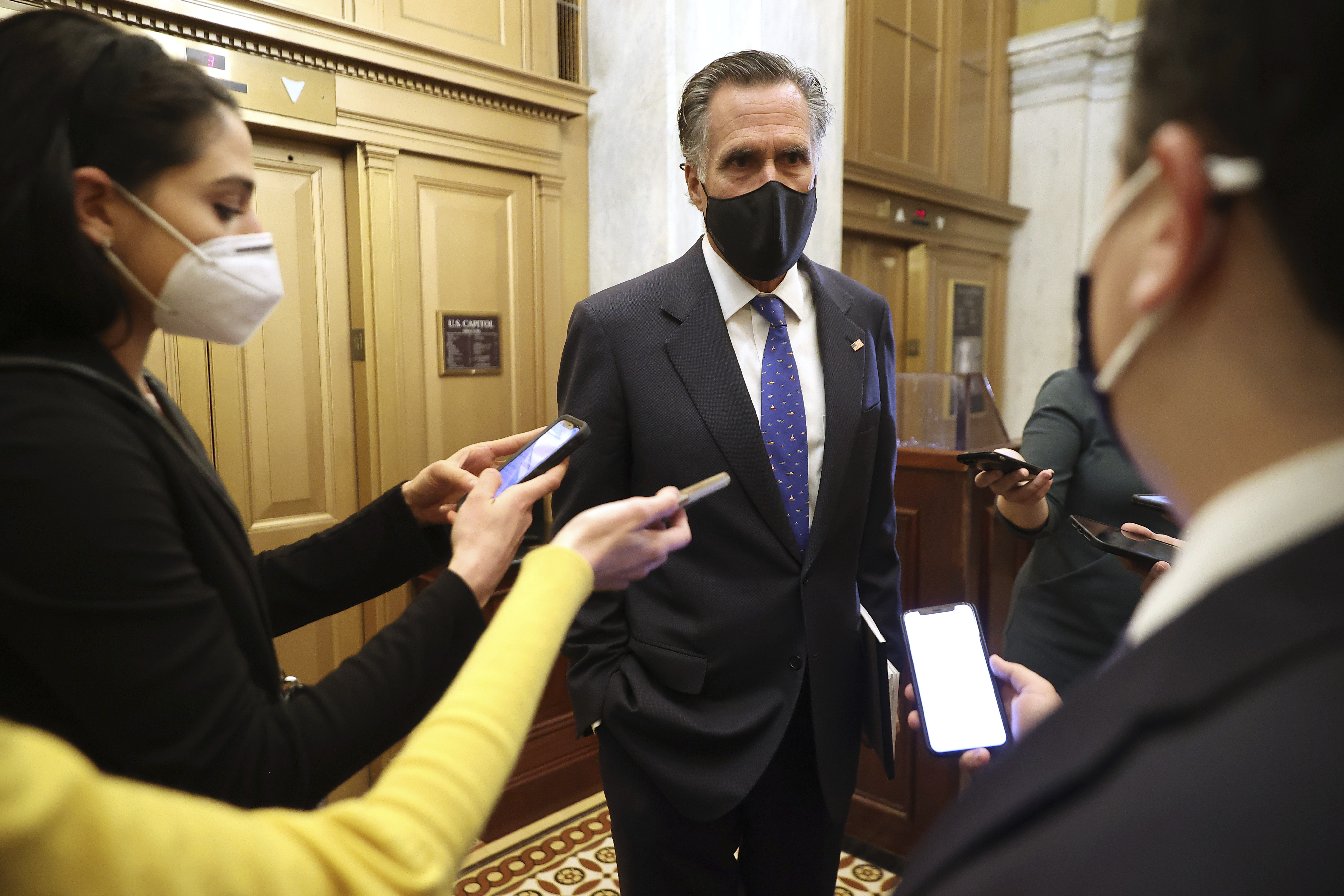 Sen. Mitt Romney, R-Utah, talks with reporters as he leaves the U.S. Capitol after the first day of Trump's second impeachment trial in the Senate, Tuesday, Feb. 9, 2021, in Washington.