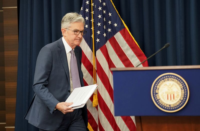 FILE PHOTO: U.S. Federal Reserve Chairman Jerome Powell arrives to speak to reporters after the Federal Reserve cut interest rates in an emergency move designed to shield the world's largest economy from the impact of the coronavirus, during a news conference in Washington, U.S., March 3, 2020. REUTERS/Kevin Lamarque