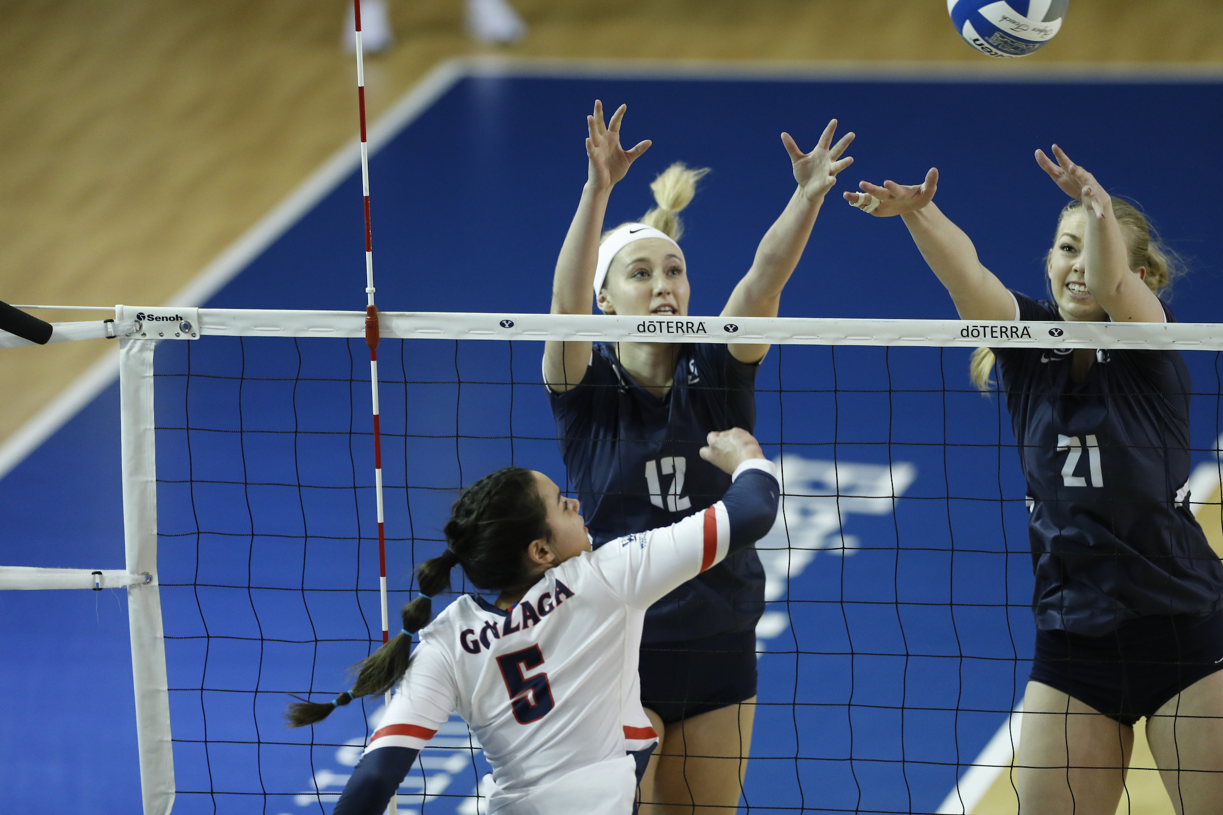 BYU outside hitter Kate Grimmer (12) and Whitney Llarenas (21) jump to block during a match with Gonzaga, Feb. 10, 2021 in Provo.