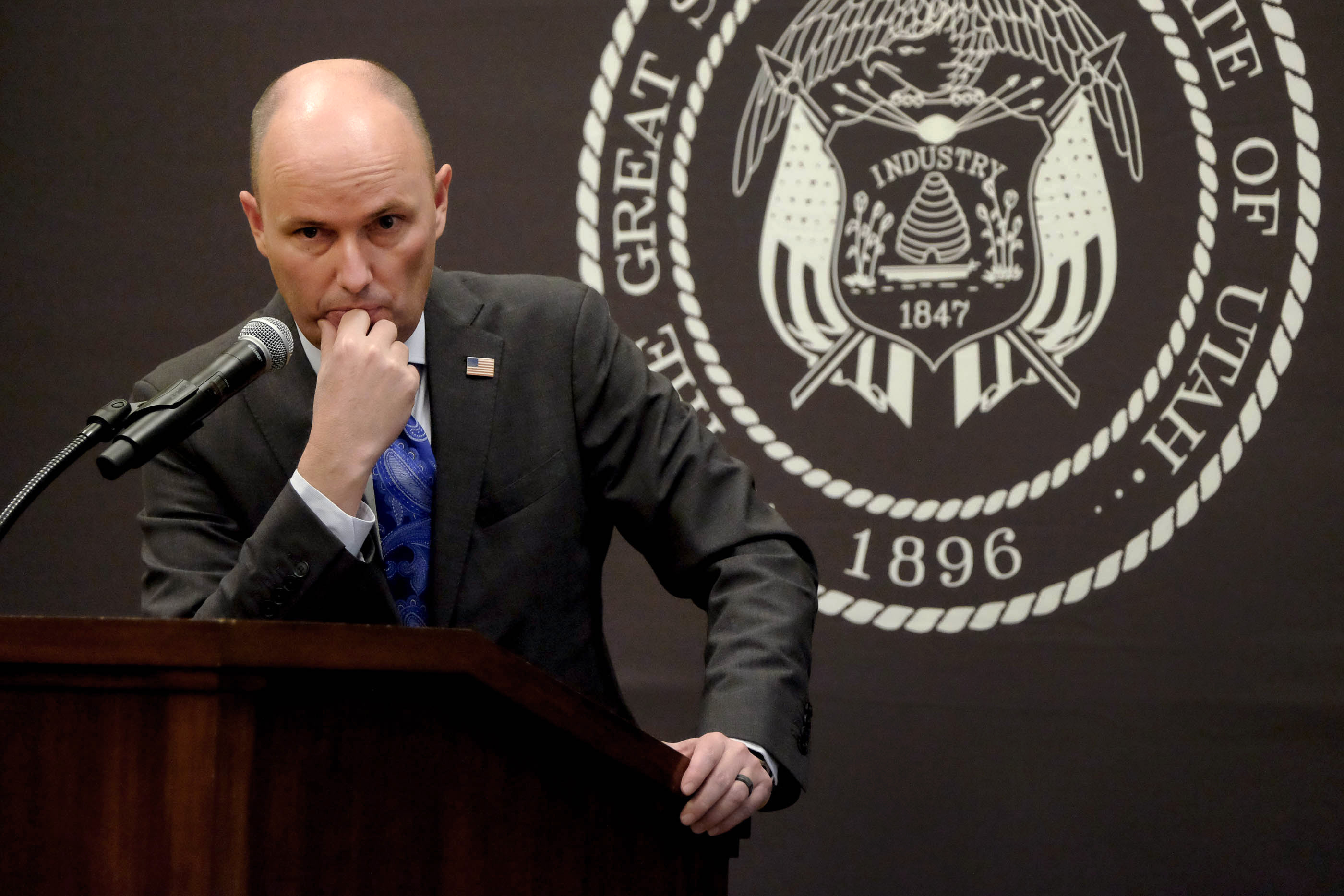 Gov. Spencer Cox listens to a question presented in Spanish during a COVID-19 briefing at the Capitol in Salt Lake City on Thursday, Feb. 11, 2021.
