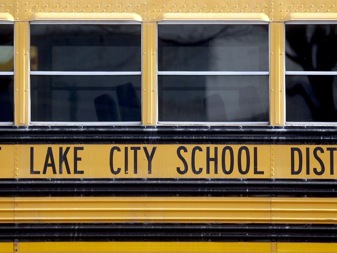 A school bus is parked outside of the Salt Lake City
School District’s Pupil Transportation building in Salt Lake City
on Thursday, Feb. 11, 2021.