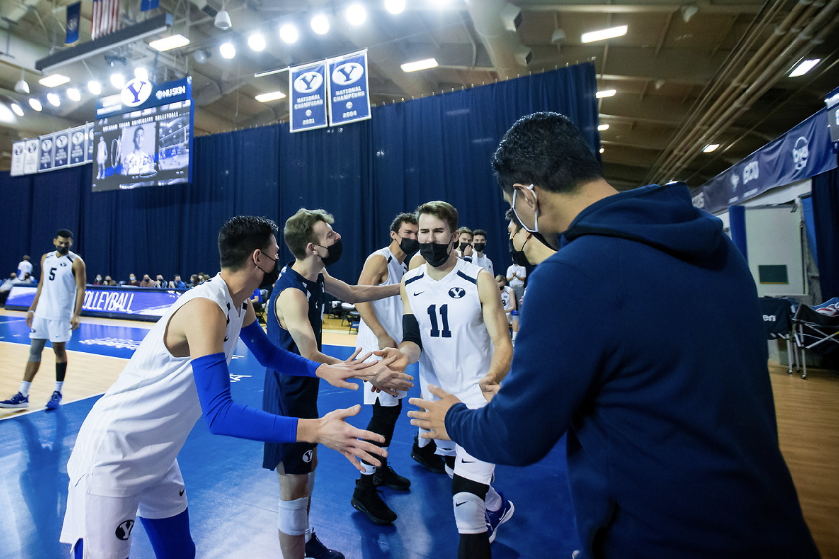 Zach Eschenberg runs out with his teammates before No. 1 BYU men's volleyball hosts UCLA, Feb. 6, 2021 in the Smith Fieldhouse in Provo. 
