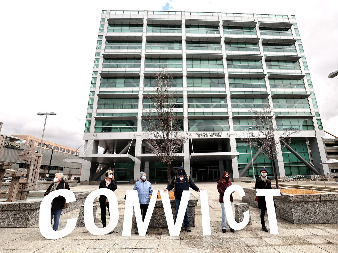 Members of Utah MoveOn hold letters spelling the word
"CONVICT” as they rally outside of GOP Sen. Mitt Romney’s office at
the Wallace F. Bennett Federal Building in Salt Lake City on
Friday, Feb. 12, 2021. The group demanded that Romney vote to
convict former President Donald Trump in his impeachment trial.