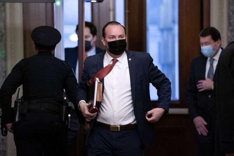 Sen. Mike Lee, R-Utah, walks on Capitol Hill on the
fifth day of the second impeachment trial of former President
Donald Trump on Saturday, Feb. 13, 2021, at the Capitol in
Washington.
