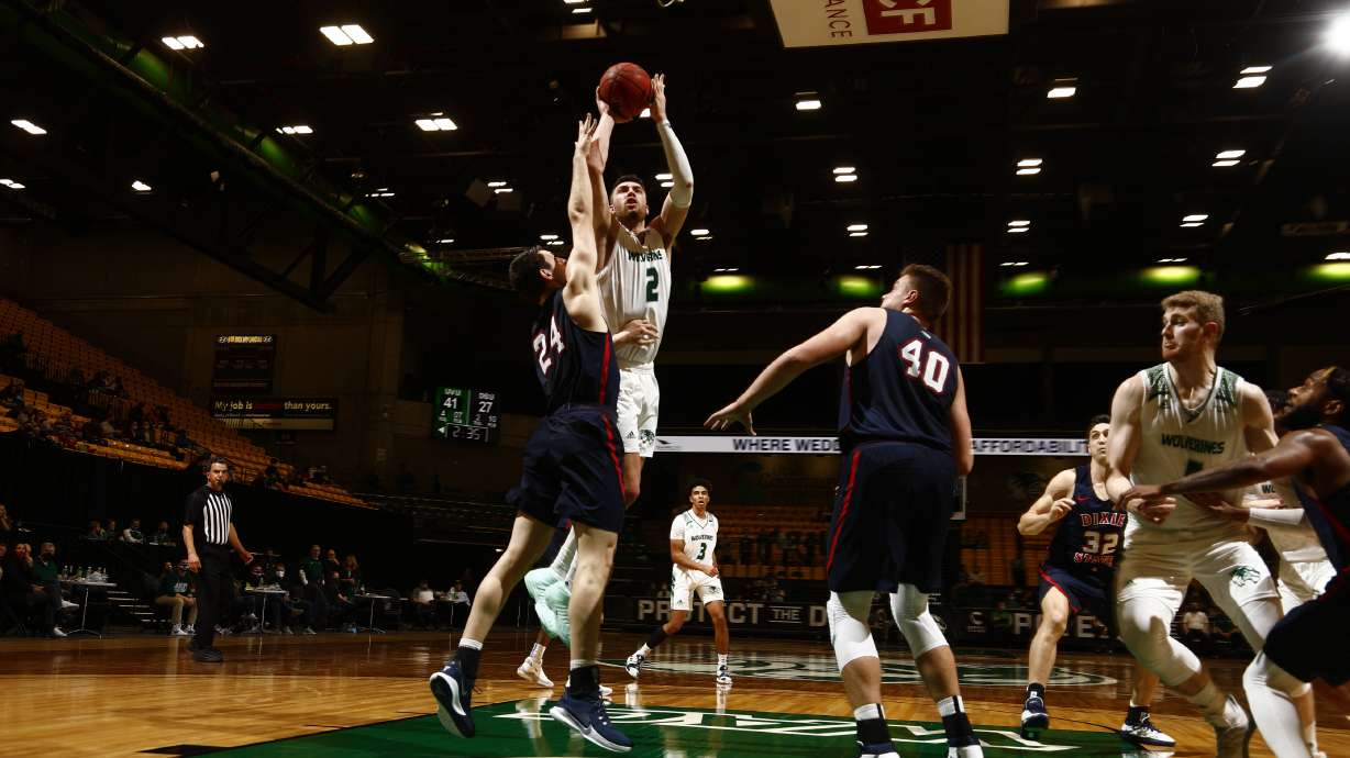 Utah Valley forward Evan Coles shoots over Dixie State during a Western Athletic Conference basketball game, Friday, Feb. 13, 2021 at the UCCU Events Center in Orem. The game was the first in the Old Hammer rivalry, a series that dates back 49 years to when the two schools were junior colleges in the Scenic West Athletic Conference.