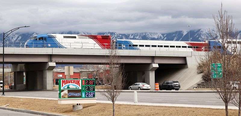 A southbound FrontRunner train crosses 9000 South in
Sandy on Friday, Feb. 12, 2021. Double-tracking FrontRunner is one
of the infrastructure projects being considered in the
Legislature’s budget talks.