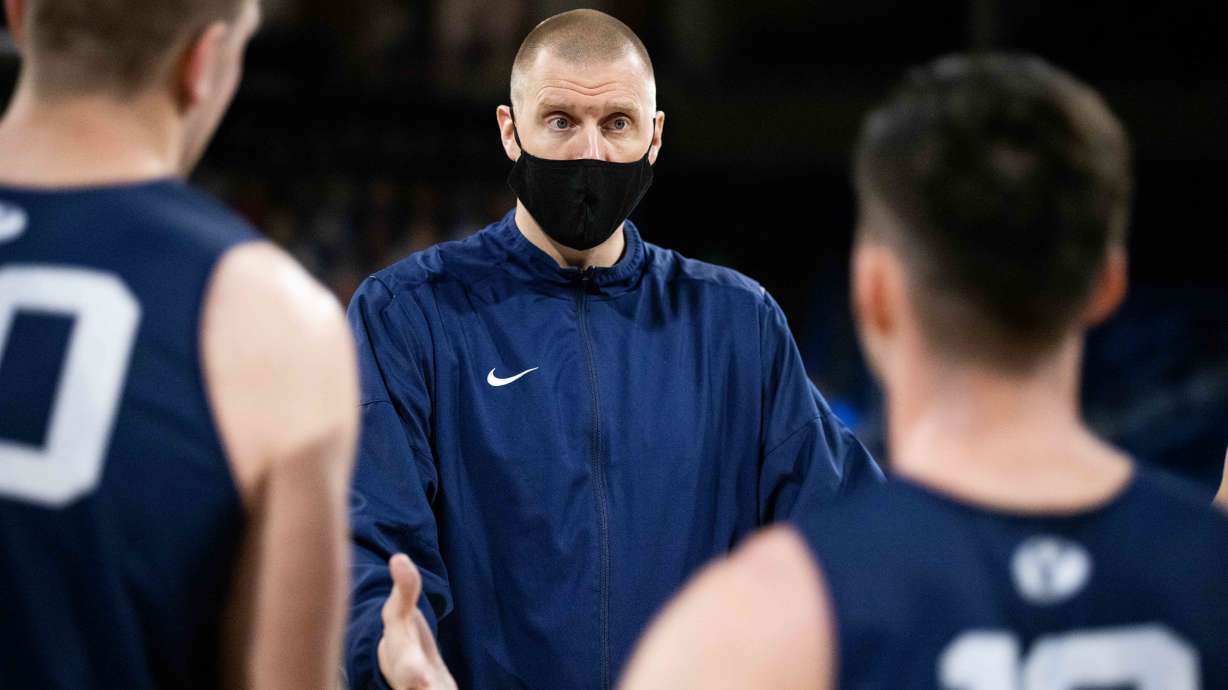 BYU coach Mark Pope coaches up his players during the 2020-21 season. Pope has shown an ability to attract players to the Provo school who don’t have connections to the program.