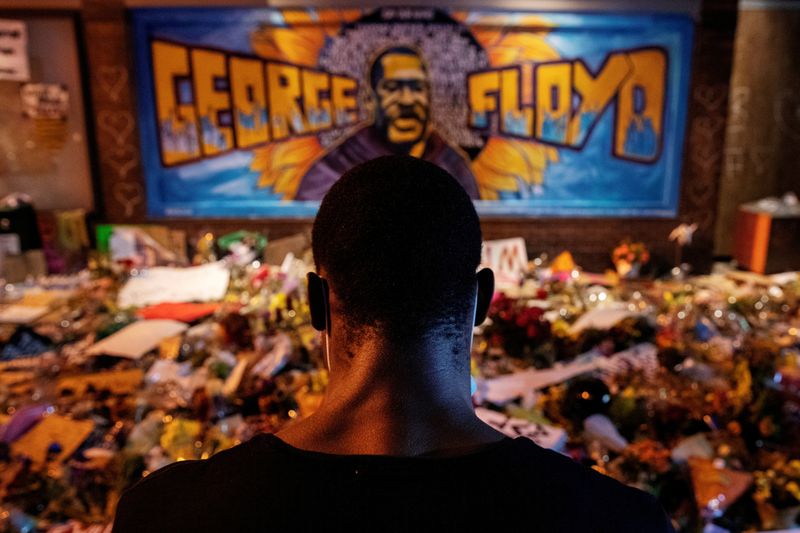 FILE PHOTO: A man recites spoken word poetry at a makeshift memorial honoring George Floyd, at the spot where he was taken into custody, in Minneapolis, Minnesota, U.S., June 1, 2020. REUTERS/Lucas Jackson/File Photo/File Photo