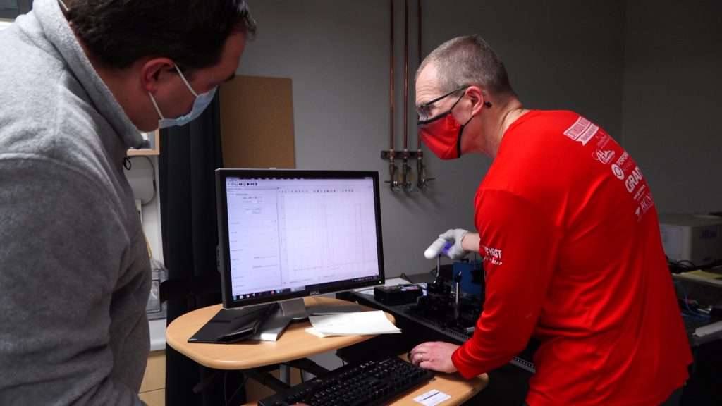 Steve Blair uses a spectrometer to measure the wavelength of each device to see if they actually fall within a germicidal wavelength range.
