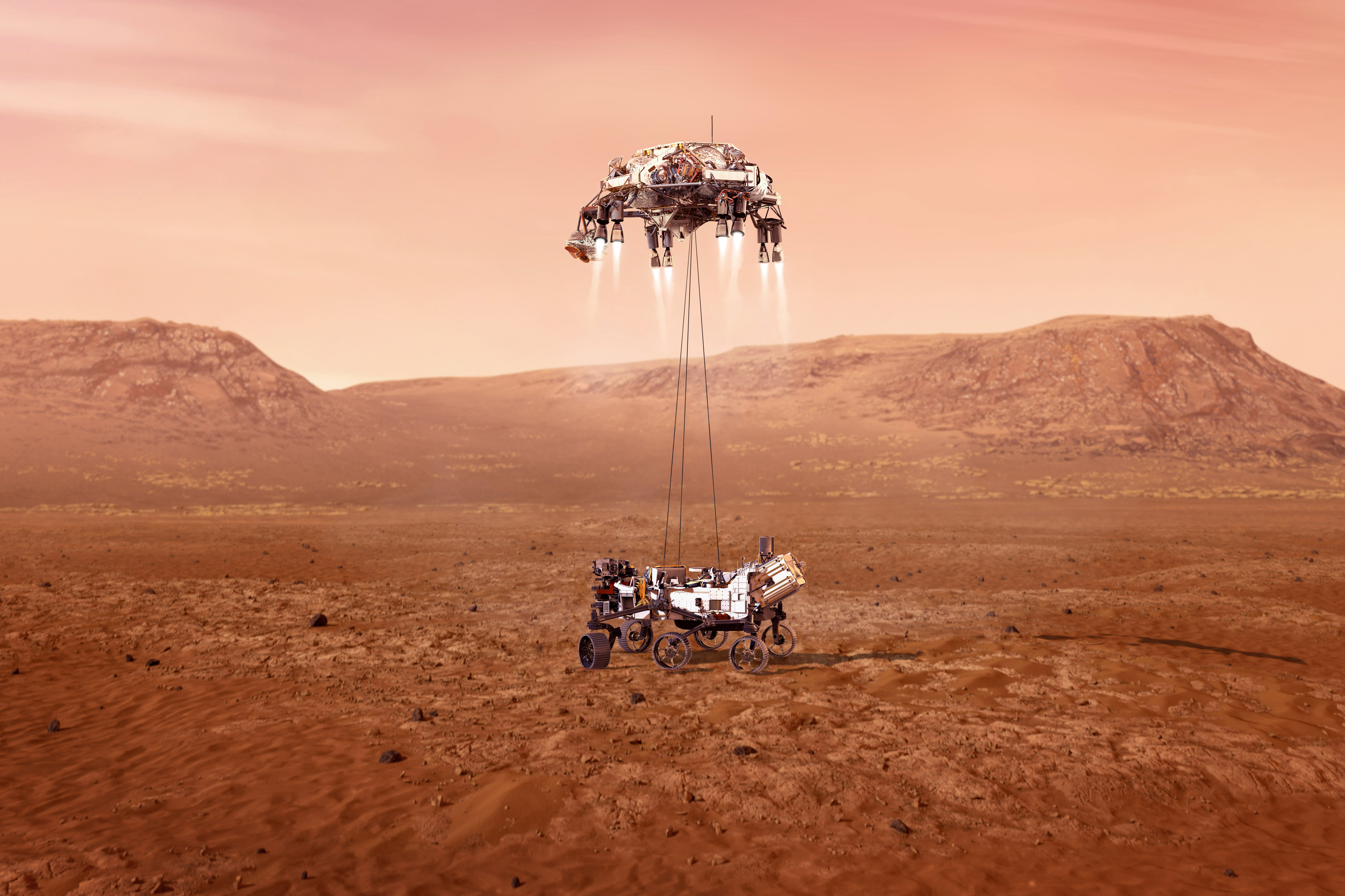 This illustration provided by NASA shows the Perseverance rover, bottom, landing on Mars. Hundreds of critical events must execute perfectly and exactly on time for the rover to land safely on Feb. 18, 2021. Entry, Descent, and Landing, or "EDL," begins when the spacecraft reaches the top of the Martian atmosphere, traveling nearly 12,500 mph (20,000 kph). EDL ends about seven minutes after atmospheric entry, with Perseverance stationary on the Martian surface.