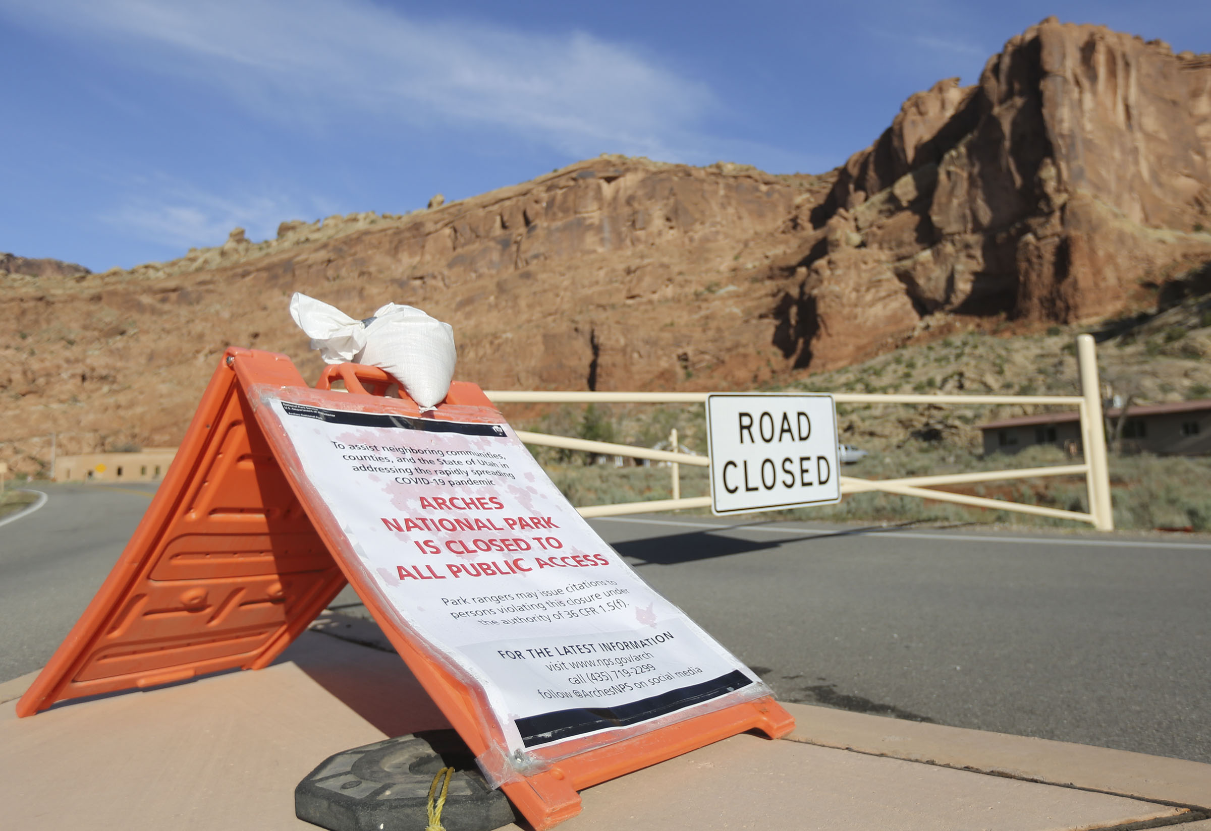 A sign alerts visitors that Arches National Park outside of Moab is closed due to the coronavirus pandemic on Sunday, April 19, 2020.