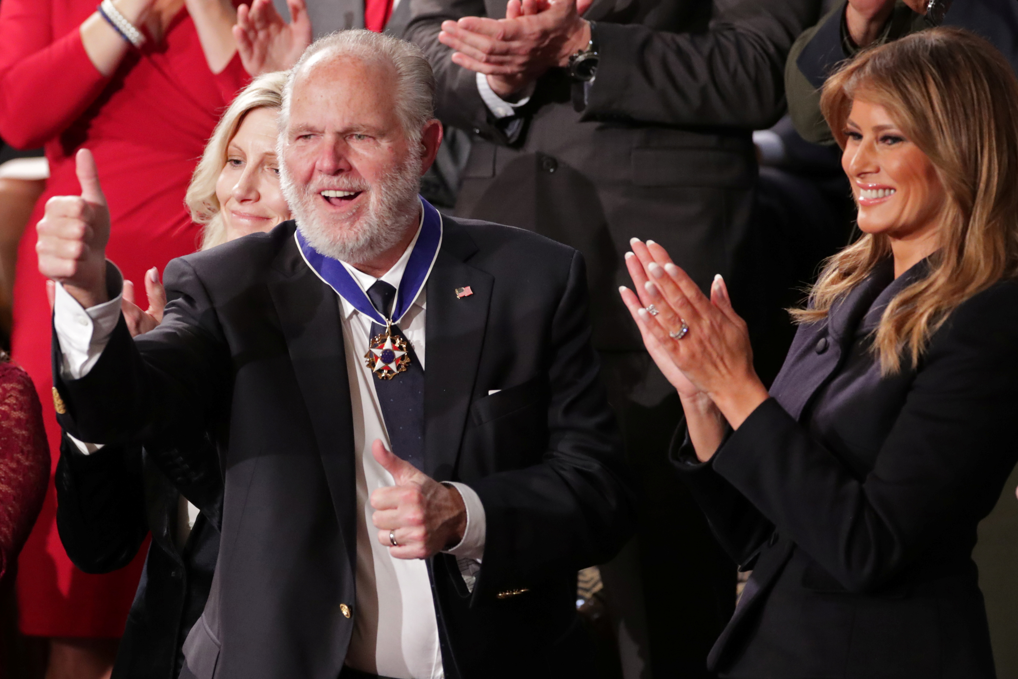 First lady Melania Trump places a Presidential Medal of Freedom to Rush Limbaugh during U.S. President Donald Trump's State of the Union address to a joint session of the U.S. Congress in the House Chamber of the U.S. Capitol in Washington, U.S., February 4, 2020.