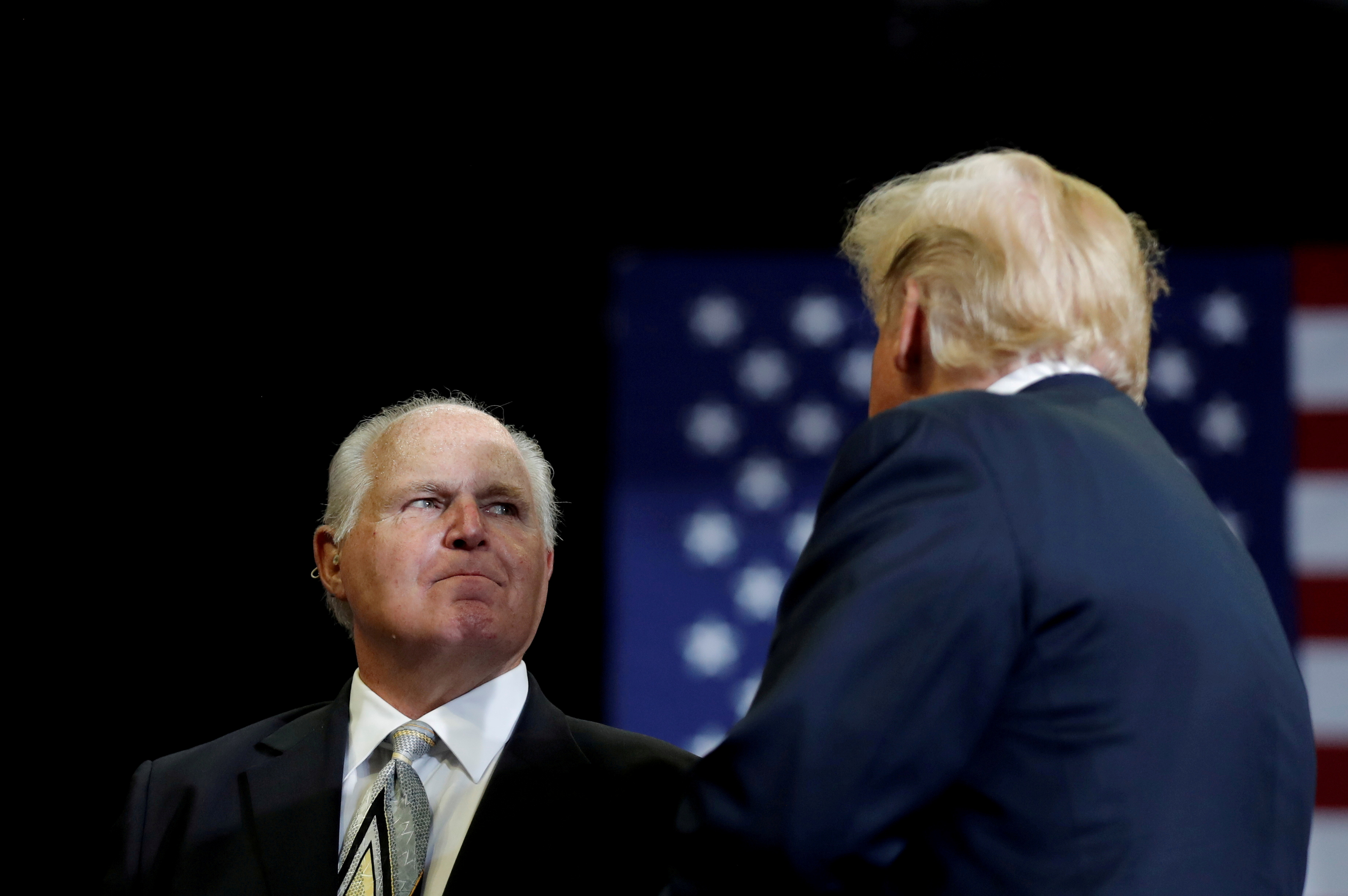 Talk show host Rush Limbaugh introduces U.S. President Donald Trump on the eve of the U.S. mid-term elections at a campaign rally at the Show Me Center in Cape Girardeau, Missouri, U.S., November 5, 2018.