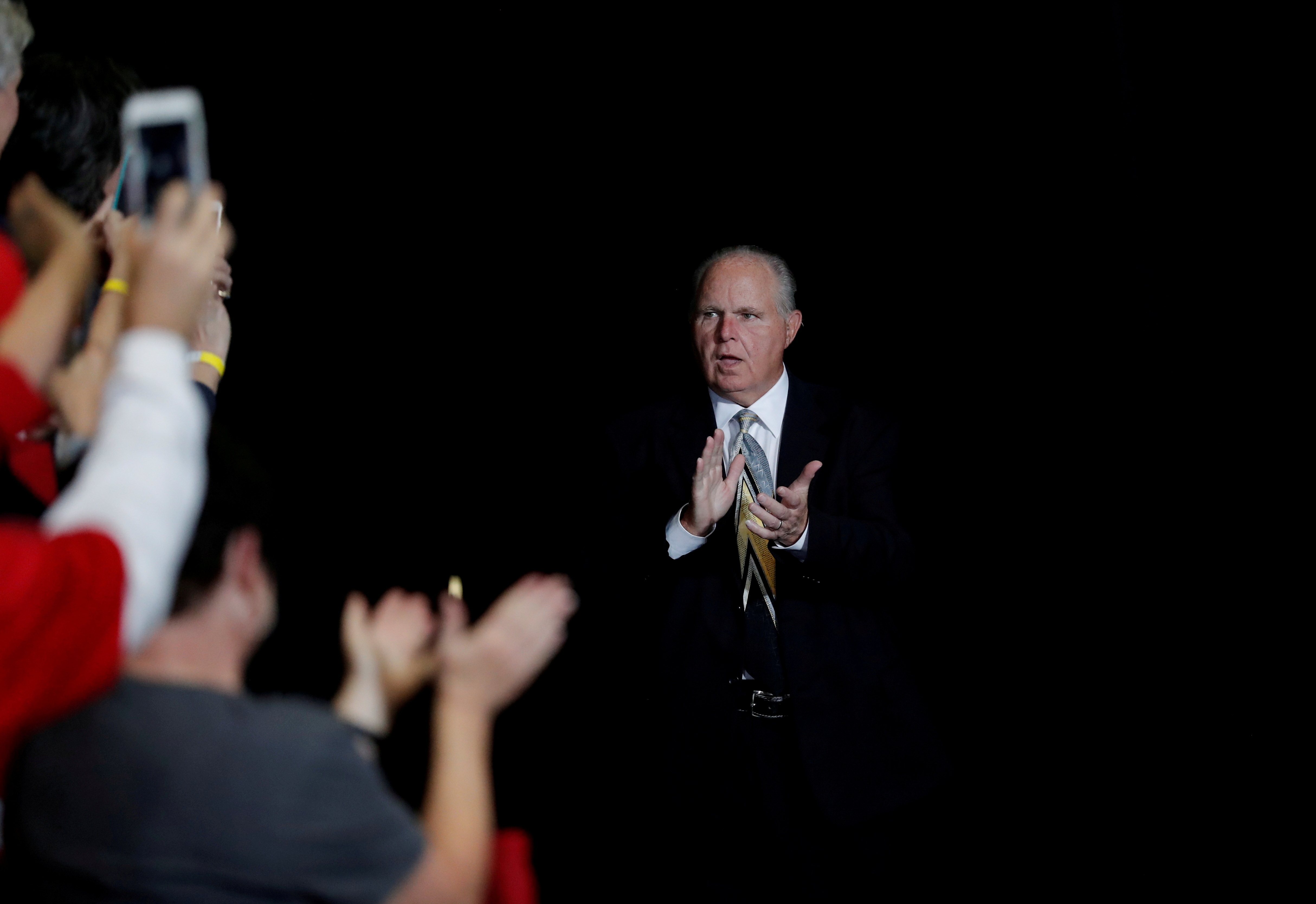 Talk show host Rush Limbaugh walks on stage on the eve of the U.S. mid-term elections at a campaign rally at the Show Me Center in Cape Girardeau, Missouri, U.S., November 5, 2018.