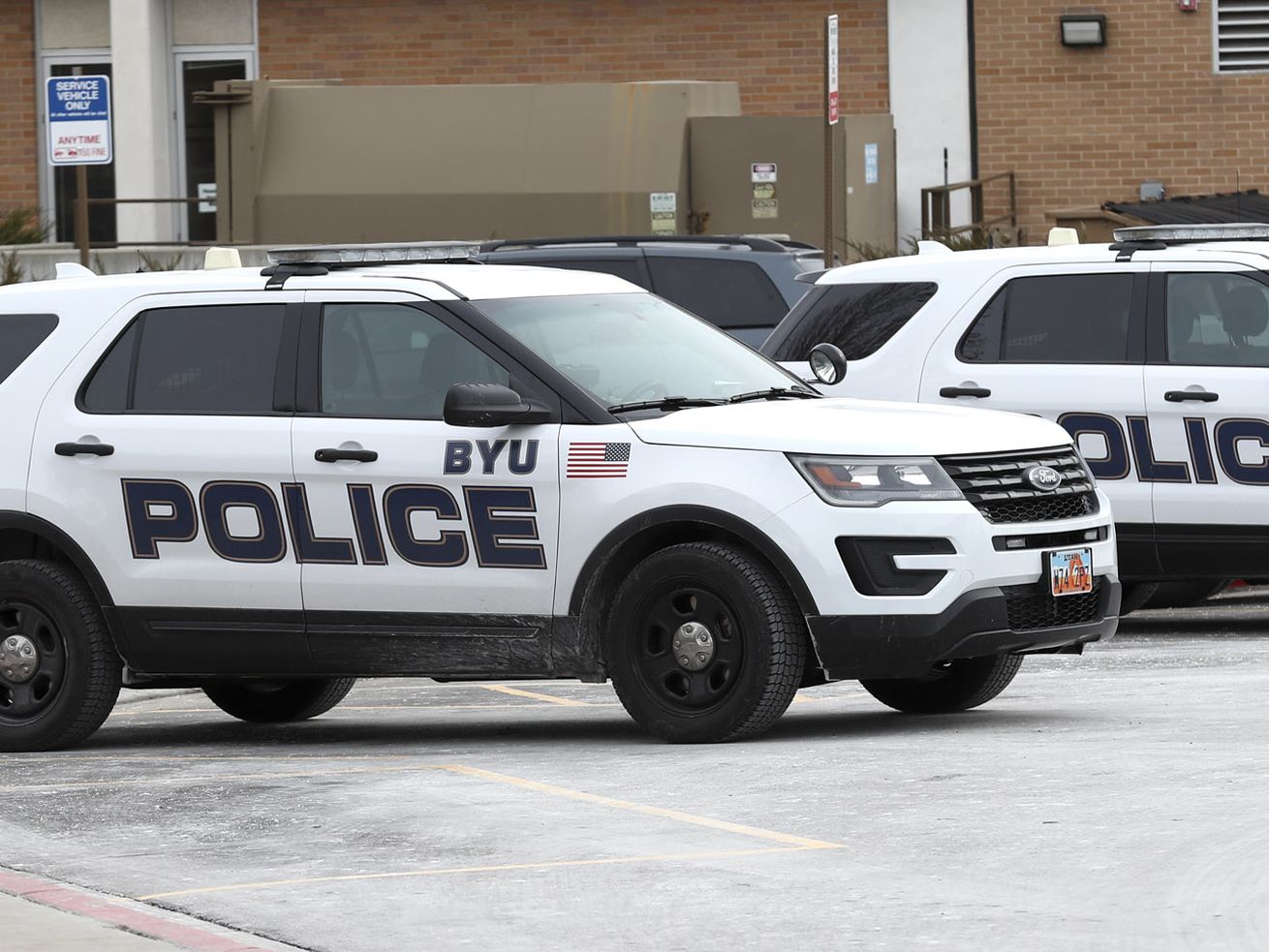 BYU police vehicles are parked outside the department’s
offices on the BYU campus in Provo on Thursday, Feb. 21, 2019.