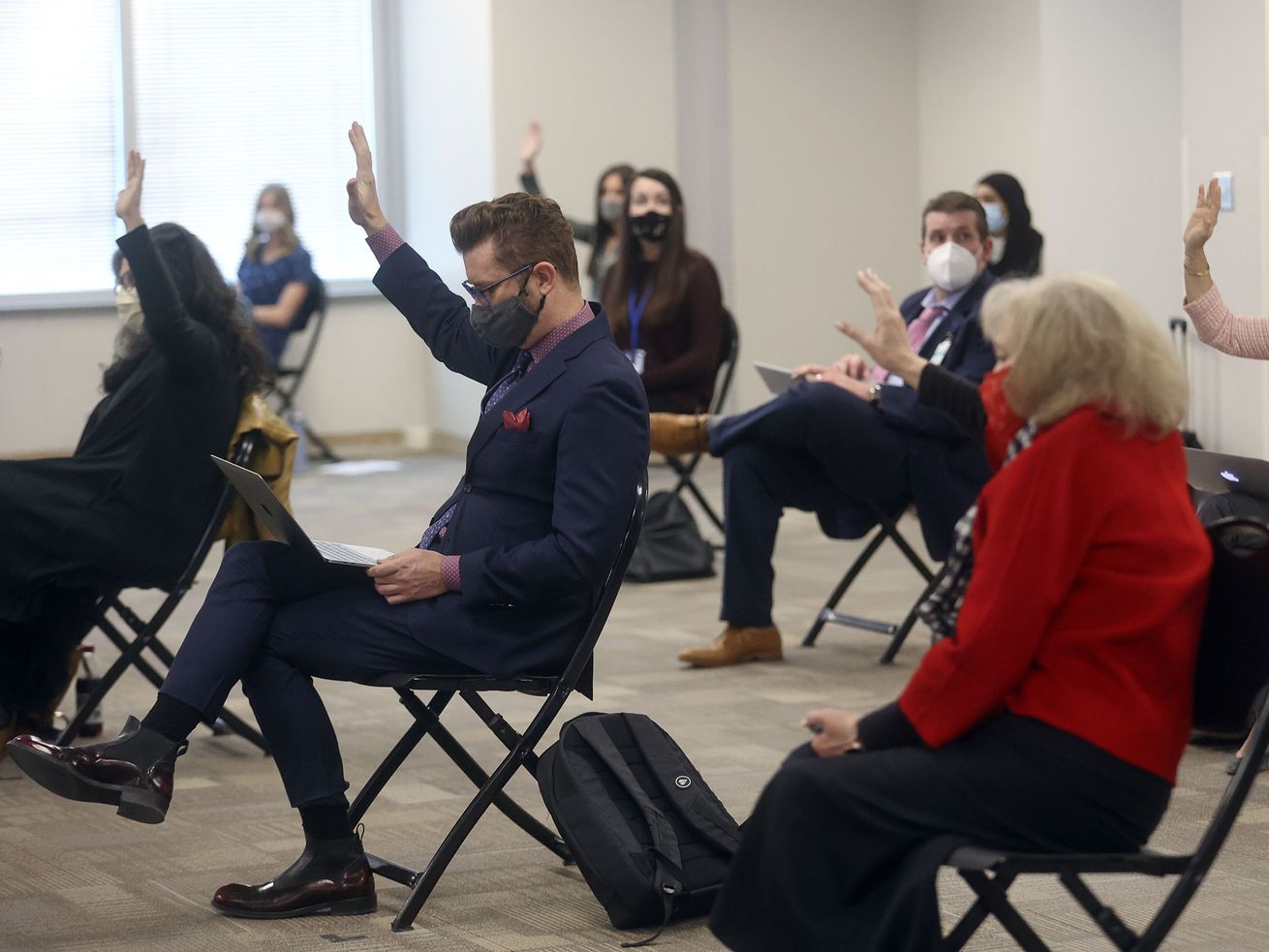 Members of the public who want to speak in opposition
to HB302 raise their hands during a House Education Committee
meeting at the State Office Building in Salt Lake City on Thursday,
Feb. 11, 2021. The bill would bar transgender athletes at
public schools to participate in girls sports.
