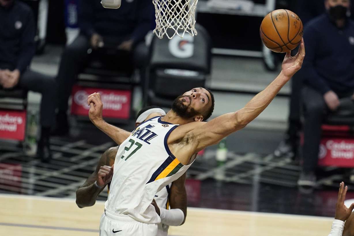 Utah Jazz center Rudy Gobert grabs a rebound against the Los Angeles Clippers during the second half of an NBA basketball game Wednesday, Feb. 17, 2021, in Los Angeles.