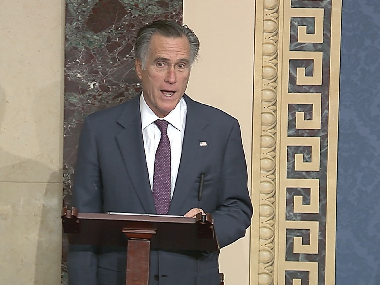 In this image from video, Sen. Mitt Romney, R-Utah,
speaks as the Senate reconvenes to debate the objection to confirm
the Electoral College vote from Arizona, after protesters stormed
into the U.S. Capitol on Wednesday, Jan. 6, 2021.
