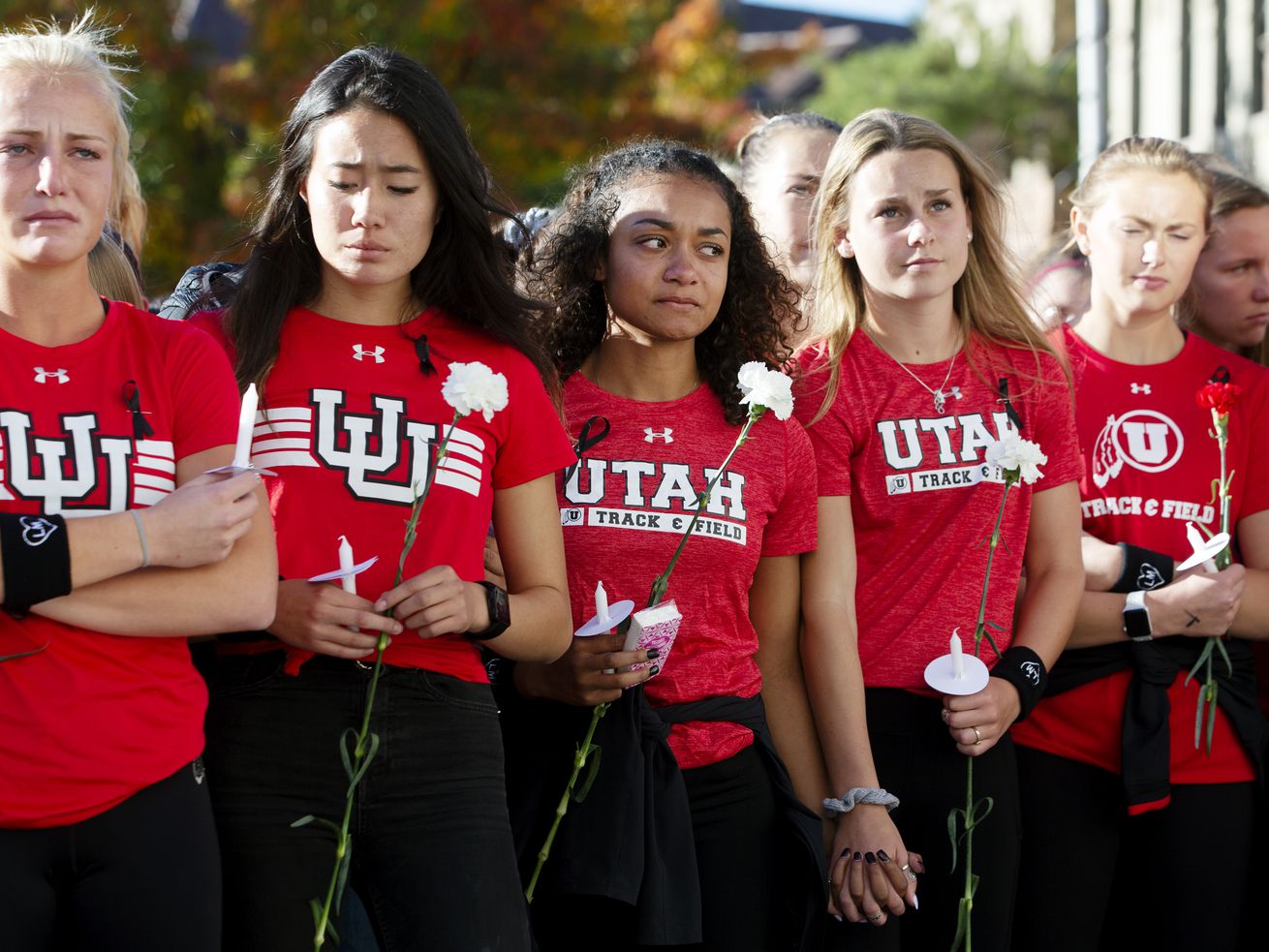 Student athletes and fellow students gather at the
University of Utah for a vigil for Lauren McCluskey on Wednesday,
Oct. 24, 2018. A lawmaker proposed changing a bill inspired by
McCluskey that would allow for prosecution if an officer shares
intimate photos of a victim to those outside of an investigation
even I the victim has died.