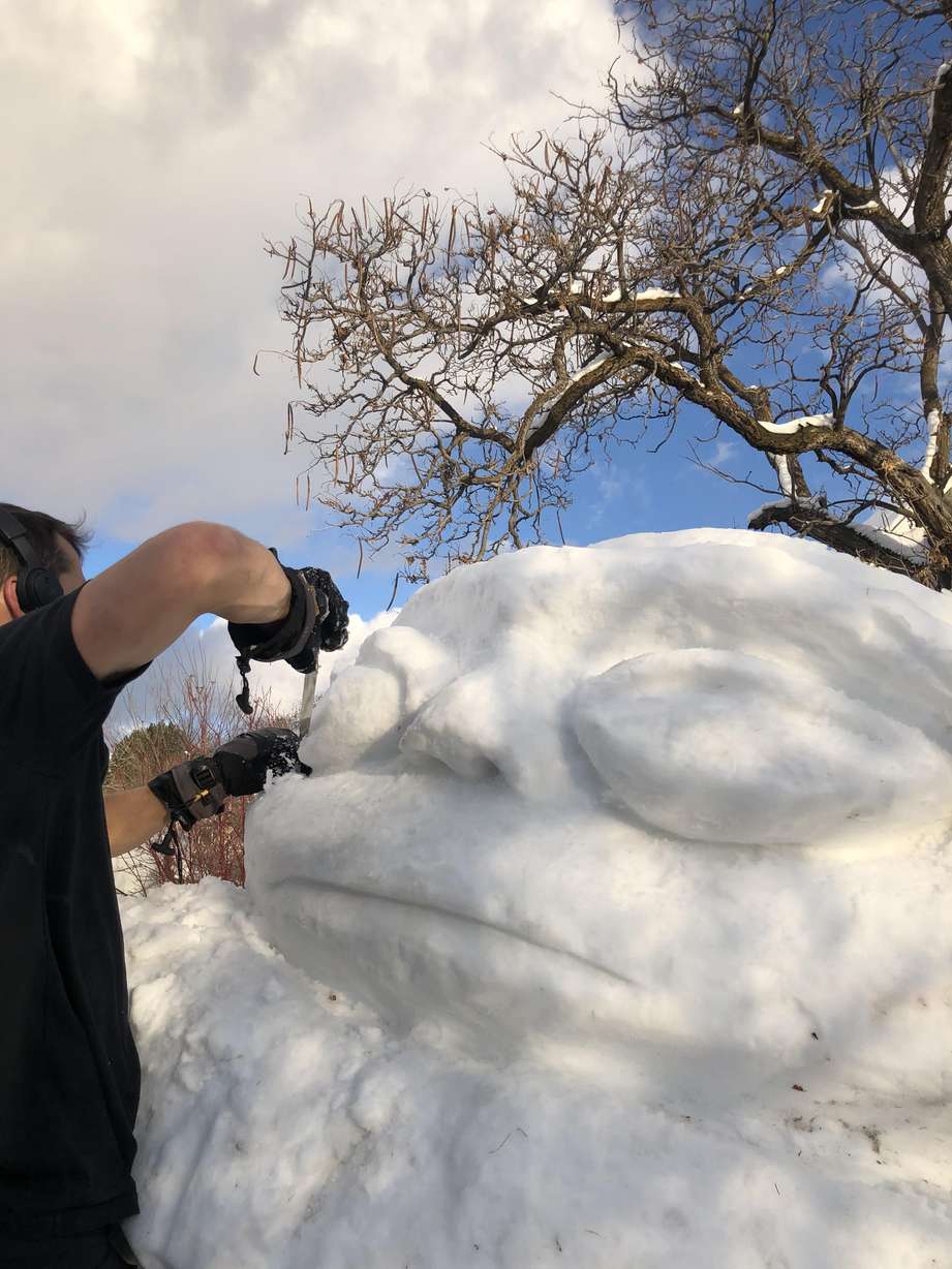 J.R. Royce builds Baby Yoda out of snow.