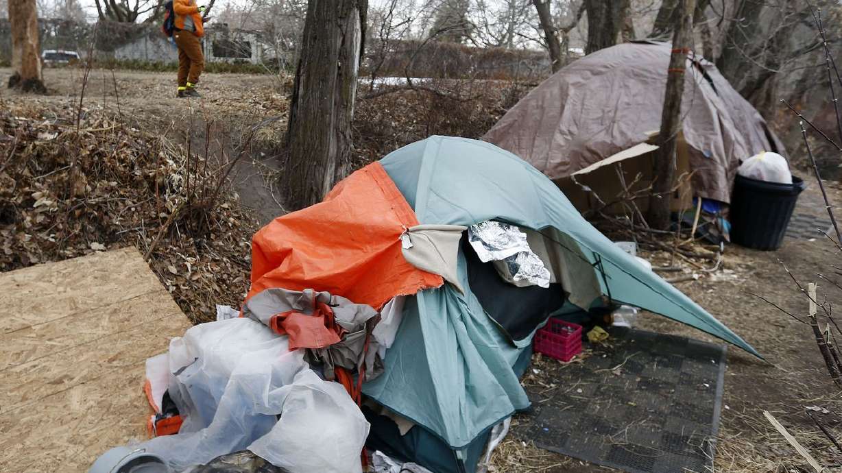 Soren Simonsen, executive director of the Jordan River
Commission, takes down information as to where he is seeing
homeless camps during the 2021 Point-in-Time count, a nationwide
annual event to survey people experiencing unsheltered
homelessness, in Salt Lake City on Thursday, Jan. 28, 2021. A Utah
House committee on Thursday OK’d a sweeping bill to restructure a
homeless governance system in the state.